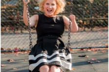 Photo, a woman smiling on a swing. PC: Maggie Marguerite Studio