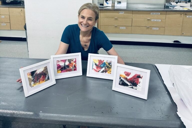 The artist, Ruth, with 4 of her art pieces. Singlehandedly creating. Unhiding through art, one canvas at a time.