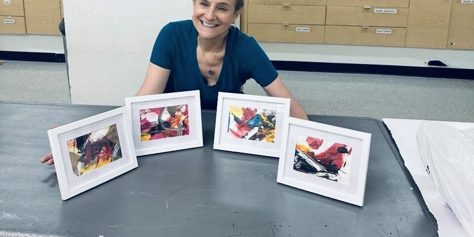 The artist, Ruth, with 4 of her art pieces. Singlehandedly creating. Unhiding through art, one canvas at a time.